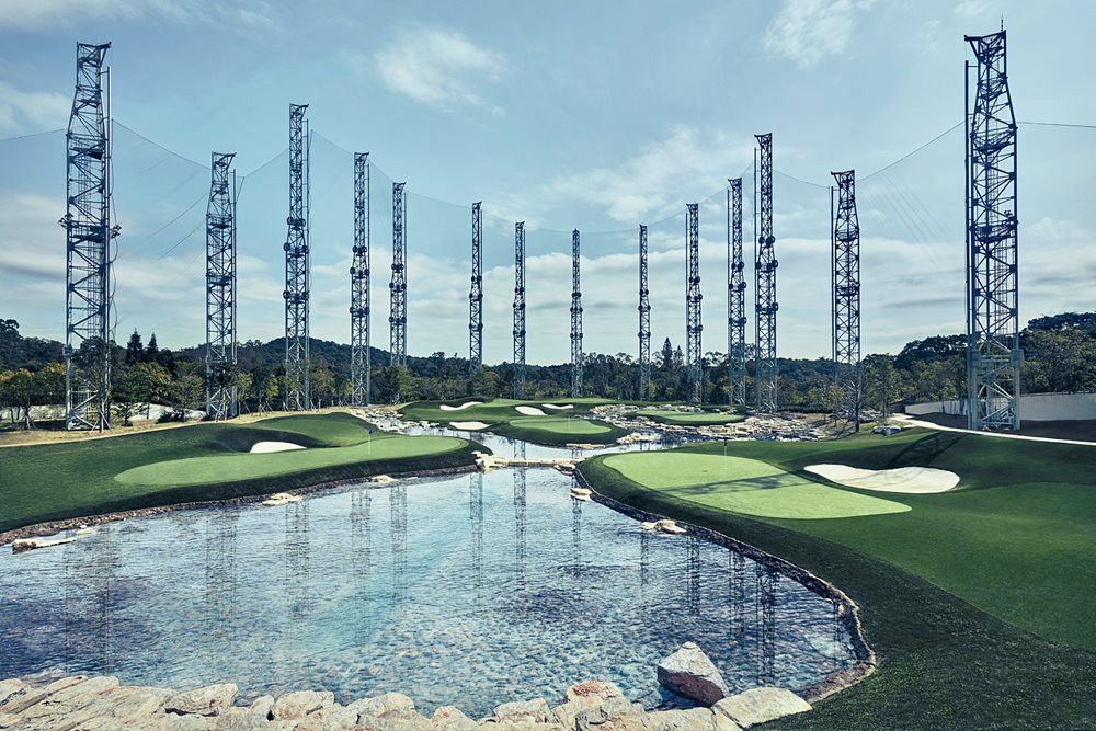 Phoenix Synthetic grass golf course with water and tall metal towers