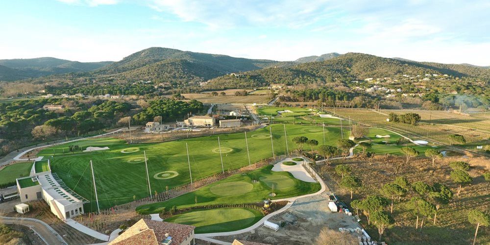 Phoenix Aerial view of a synthetic grass golf course surrounded by hills
