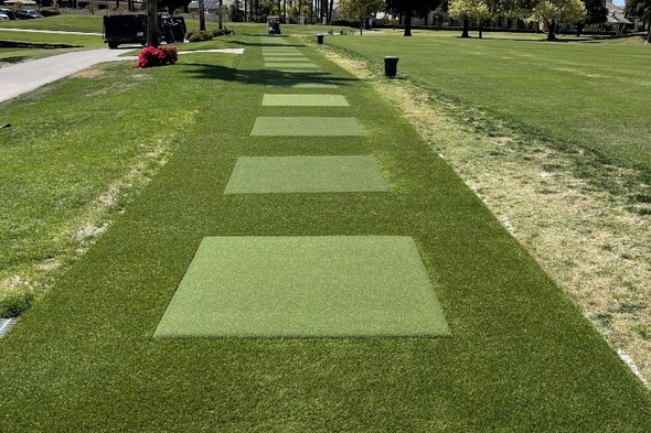 Phoenix Outdoor tee line with light green synthetic grass boxes inside a dark green synthetic grass strip